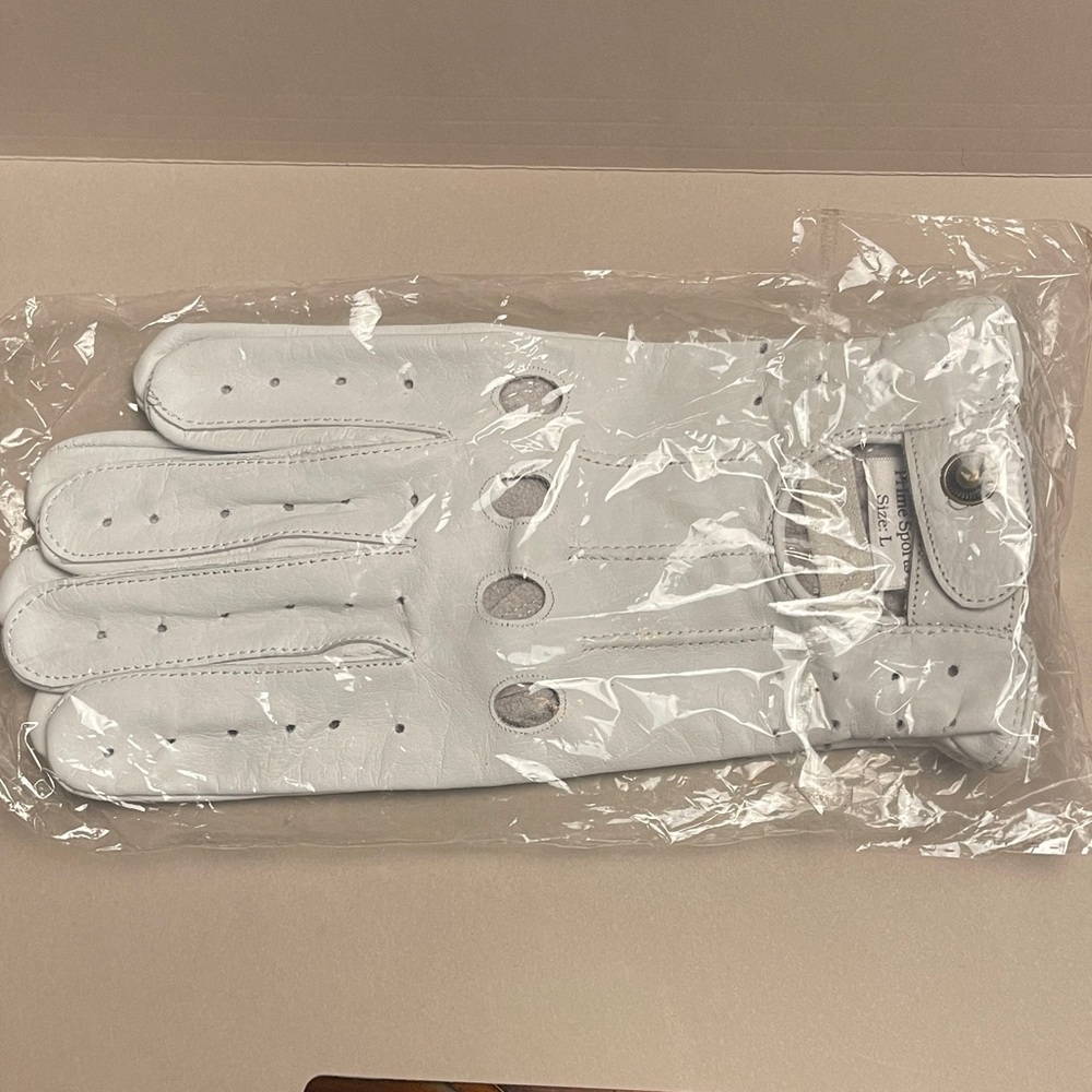 Golfing anyone?  Men’s/Women’s pair of White Leather golf Gloves in pkg.